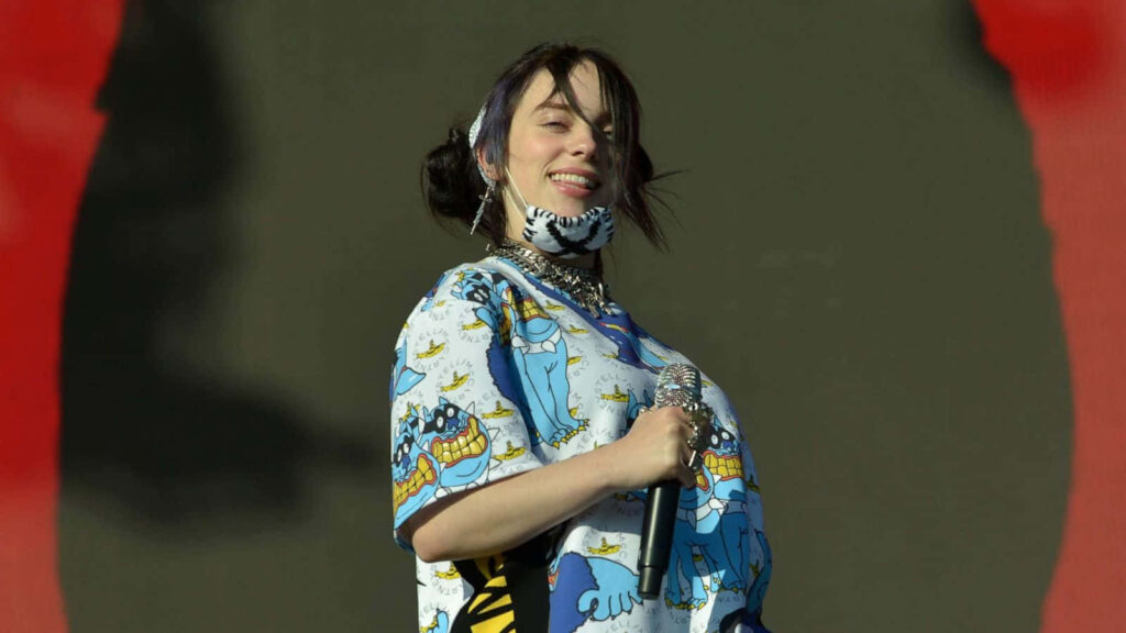 Vibrant Billie Eilish Live Performance Wallpaper: Confidence & Style