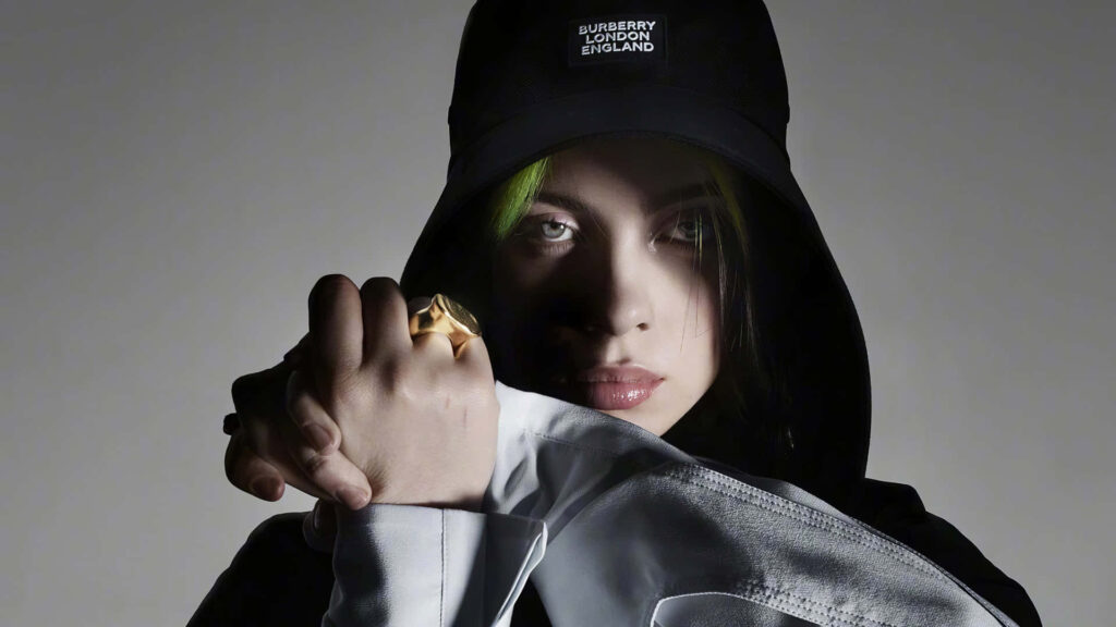 Billie Eilish: Confident & Unique in Stylish Outfit - Wallpaper Background