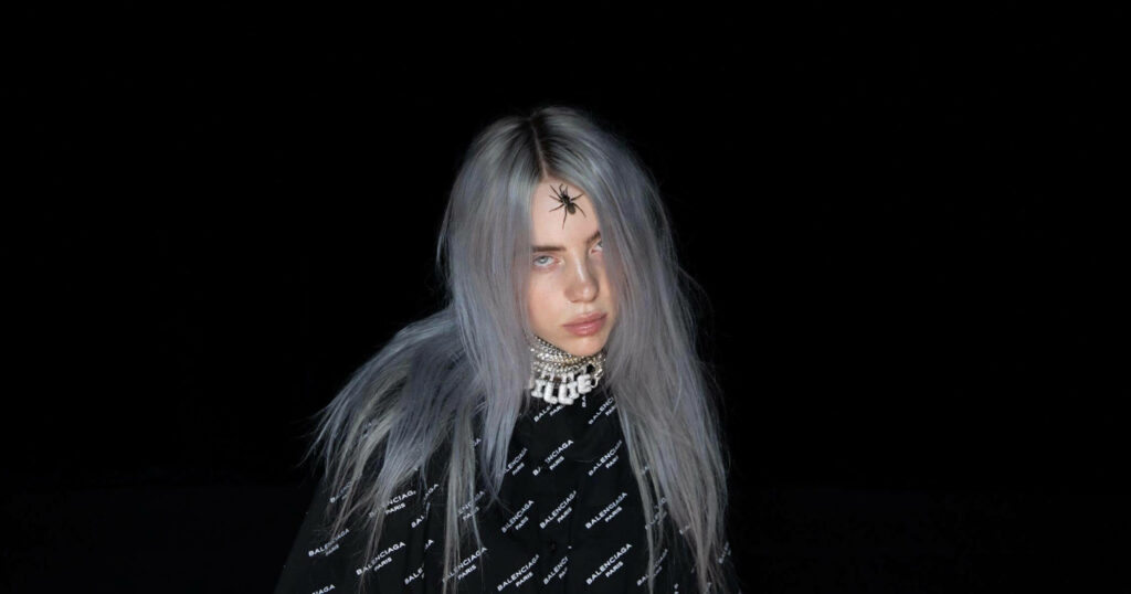 Billie Eilish: Unique Style & Presence in Striking Dark Wallpaper