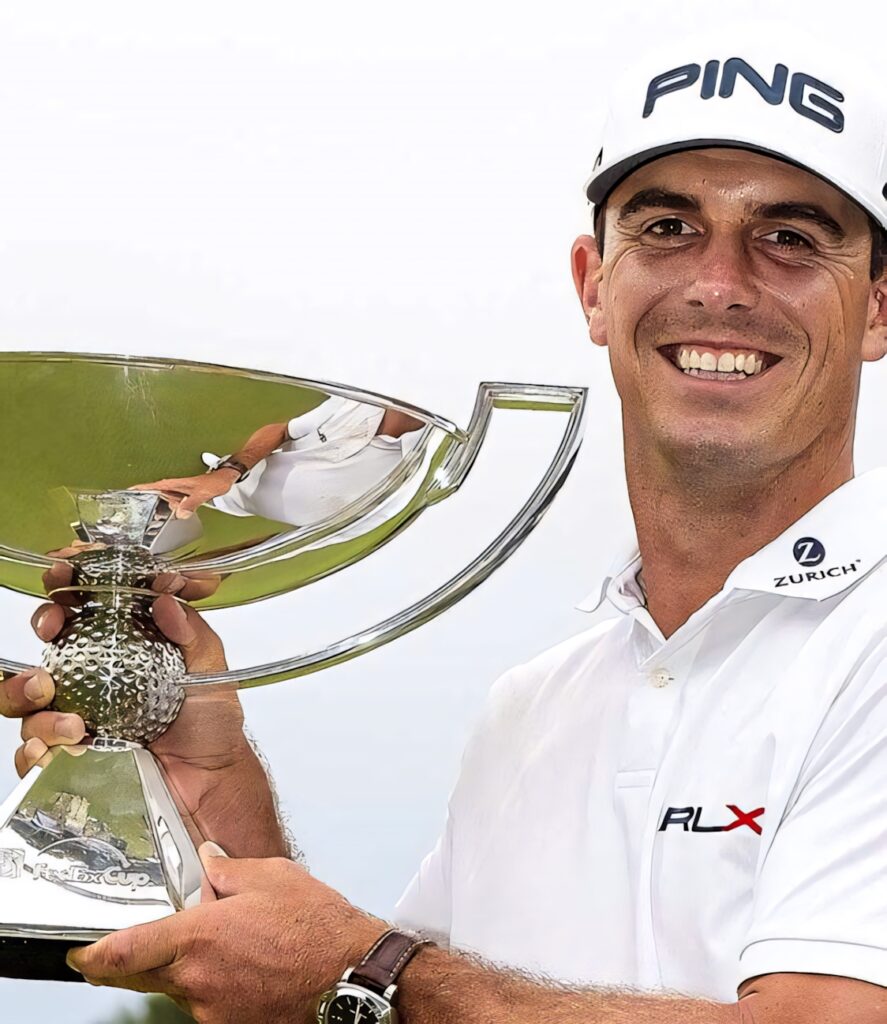 Professional golfer Billy Horschel celebrating victory holding championship trophy on golf course Wallpaper