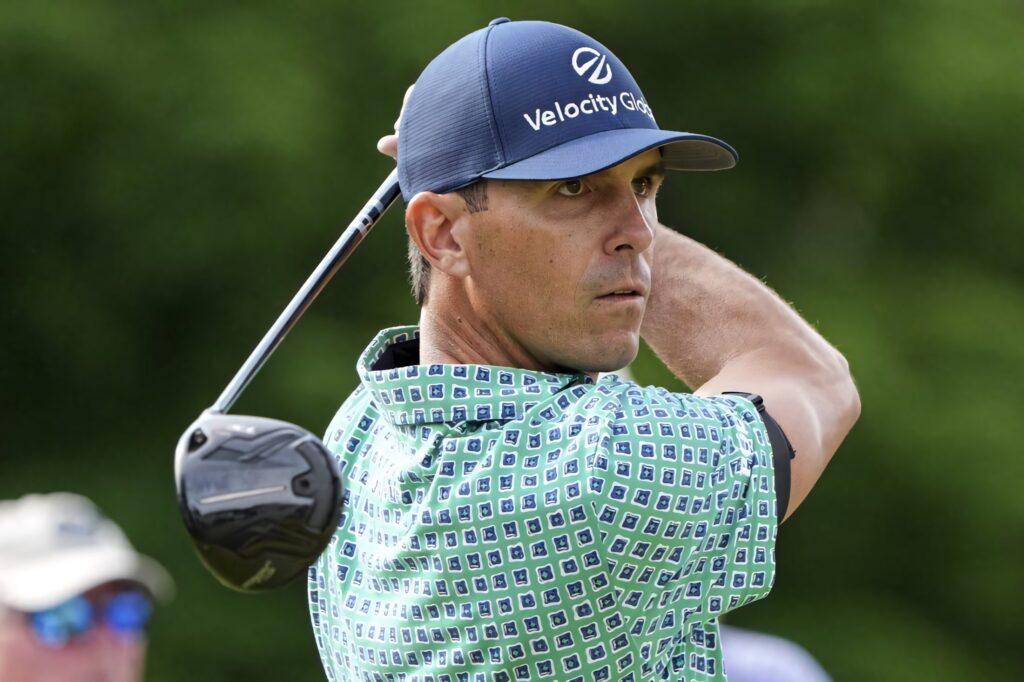 Billy Horschel focused golf swing close-up vibrant golf course background wallpaper image