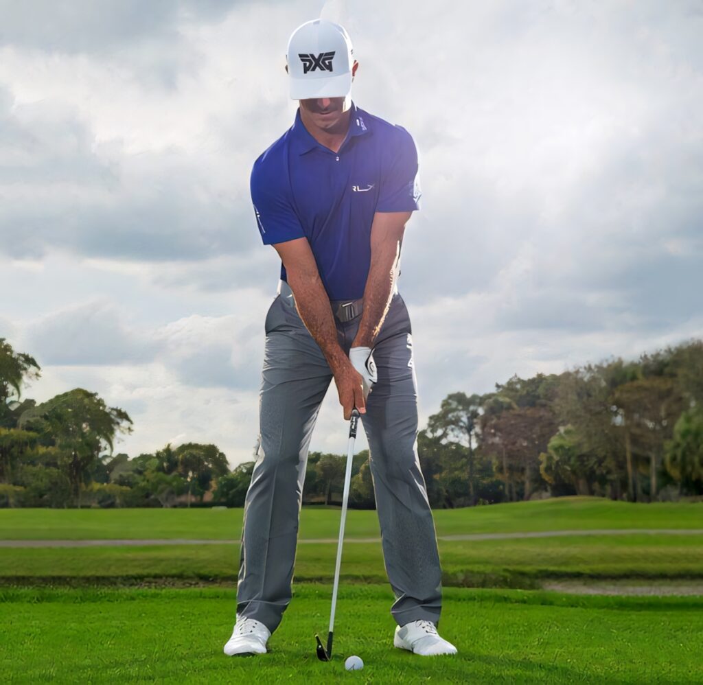 Billy Horschel golf swing on lush green course under bright partly cloudy sky wallpaper background