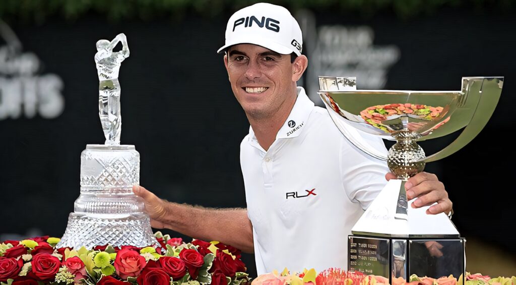 Professional golfer Billy Horschel poses with trophies showcasing his golf course success wallpaper