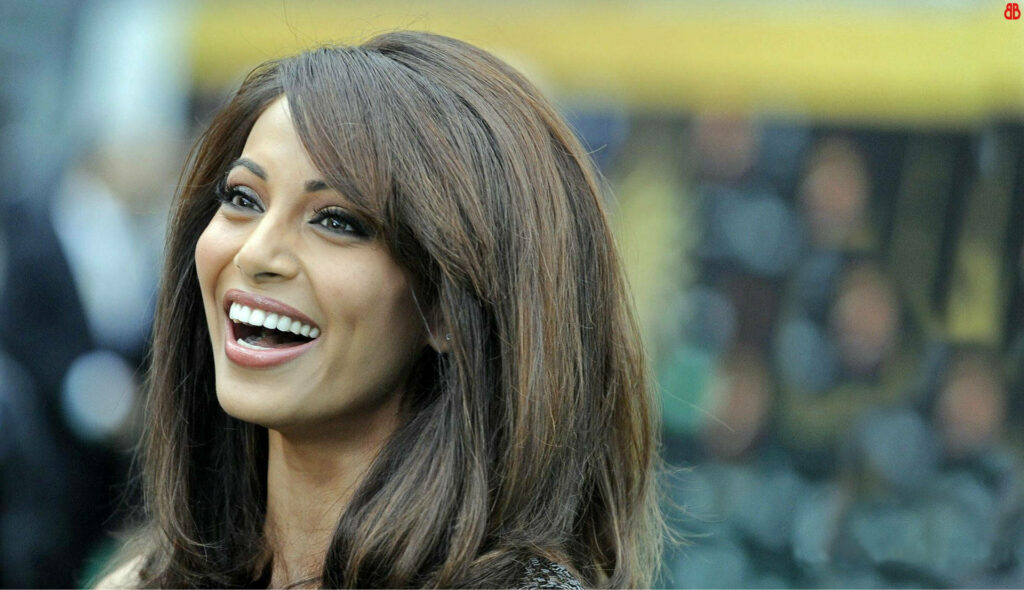 Bipasha Basu smiling brightly in happy wallpaper radiating positivity and joyful energy background