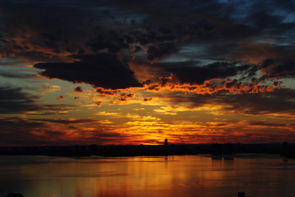Biscayne Bay Miami dawn wallpaper vibrant orange gold sky calm ocean city skyline reflection