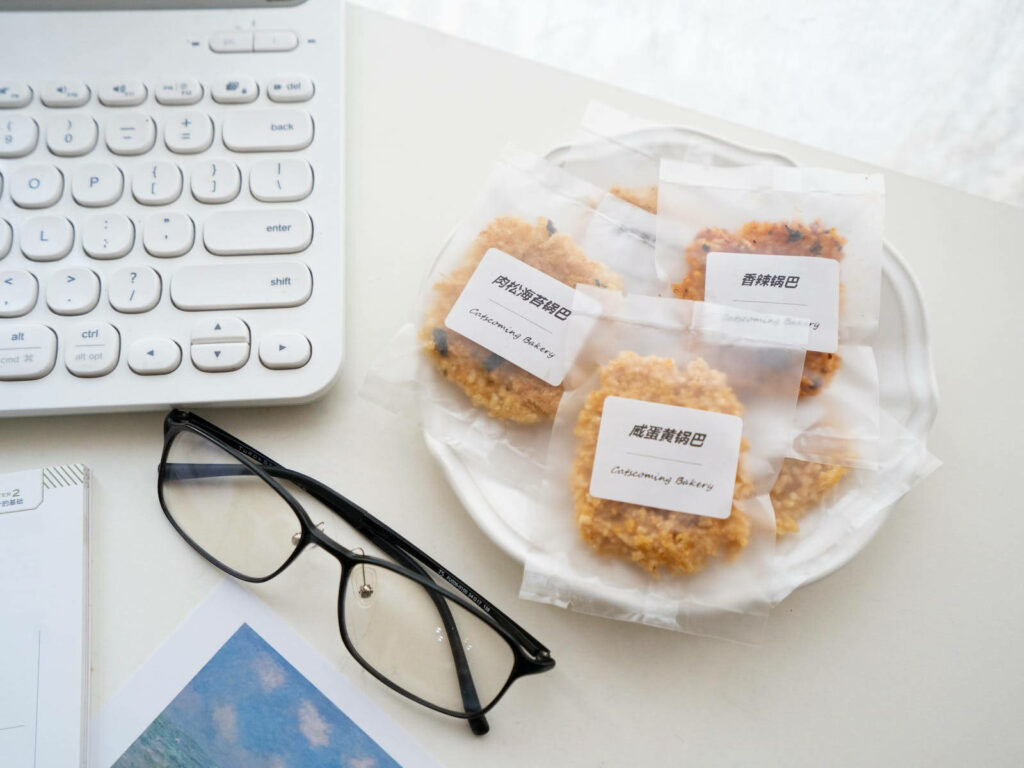 Delicious Assortment: A Vibrant Flat-lay Snapshot Showcasing an Array of Delectable Biscuits on a Work Desk Wallpaper