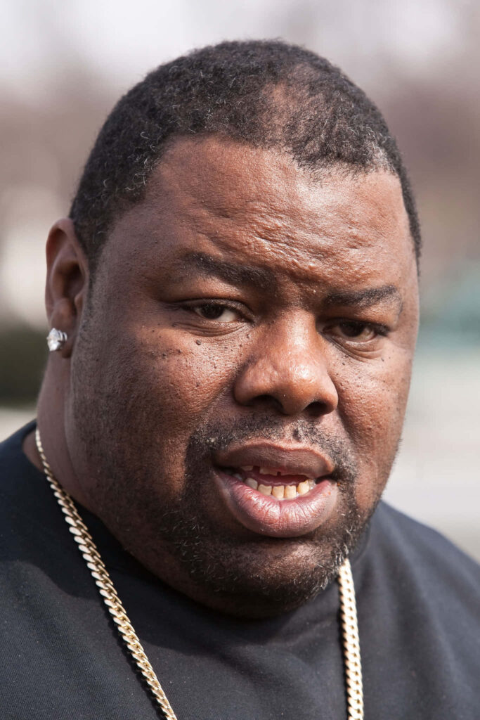Close-up portrait of Biz Markie showing expressive features and iconic hip hop style wallpaper