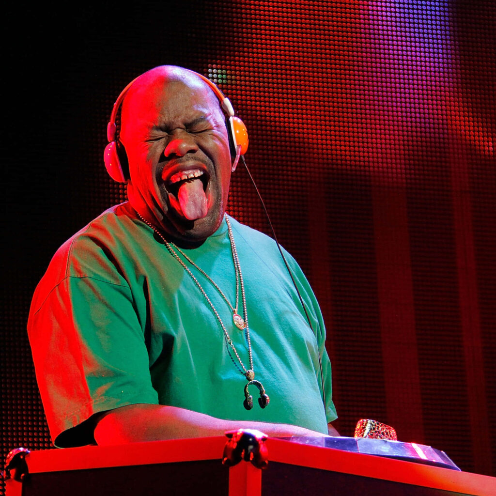 Biz Markie DJ performance vibrant wallpaper colorful stage lighting energetic expression