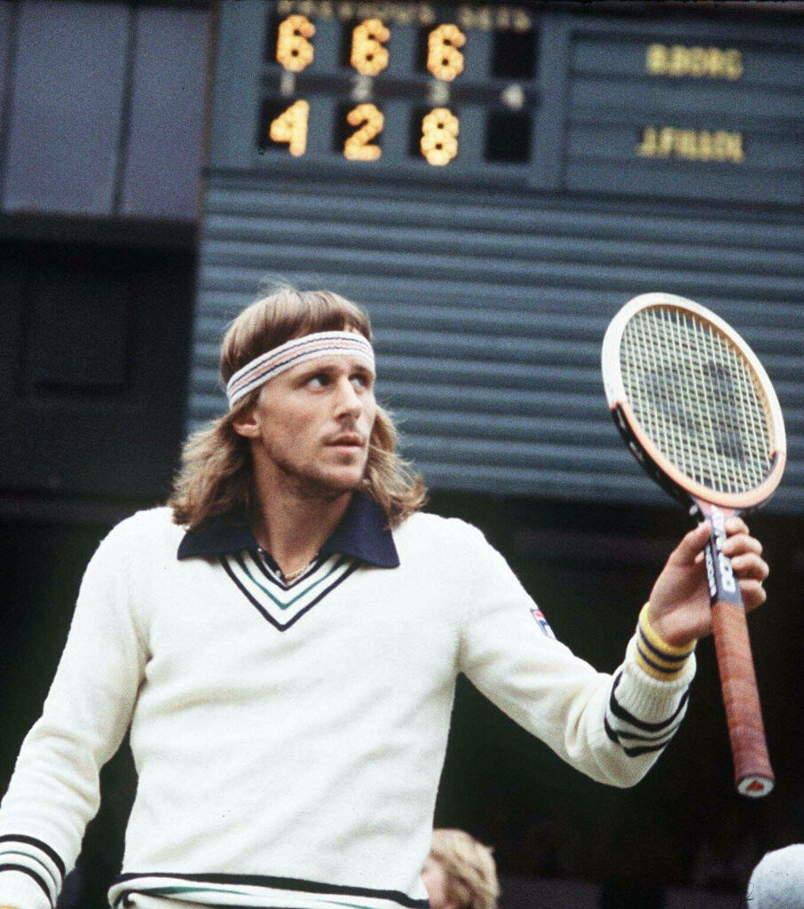 Björn Borg confident on tennis court classic attire holding racket scoreboard shows match dominance Wallpaper