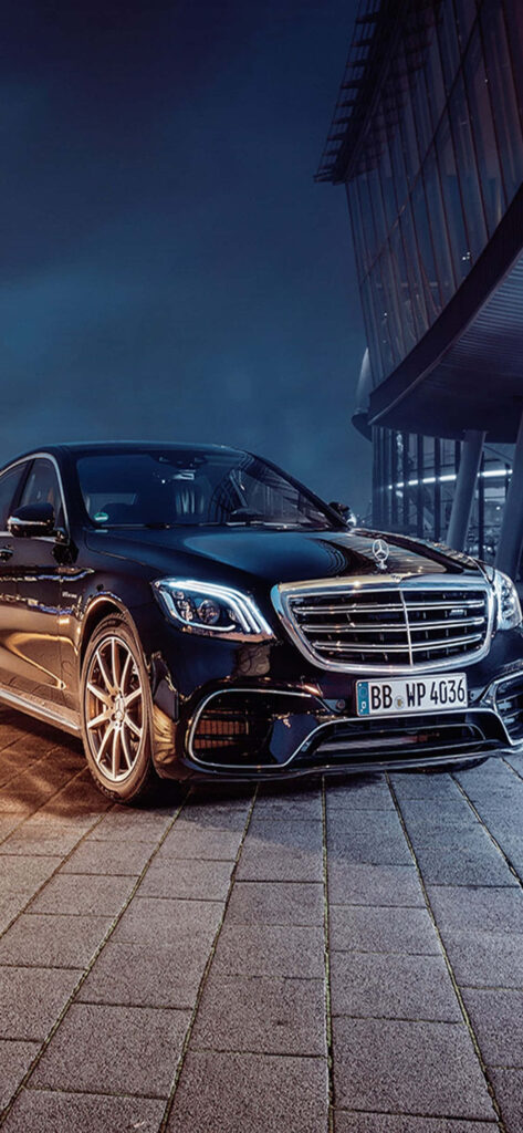 Black 2019 Mercedes-Benz S-Class luxury sedan in urban night setting sleek design wallpaper