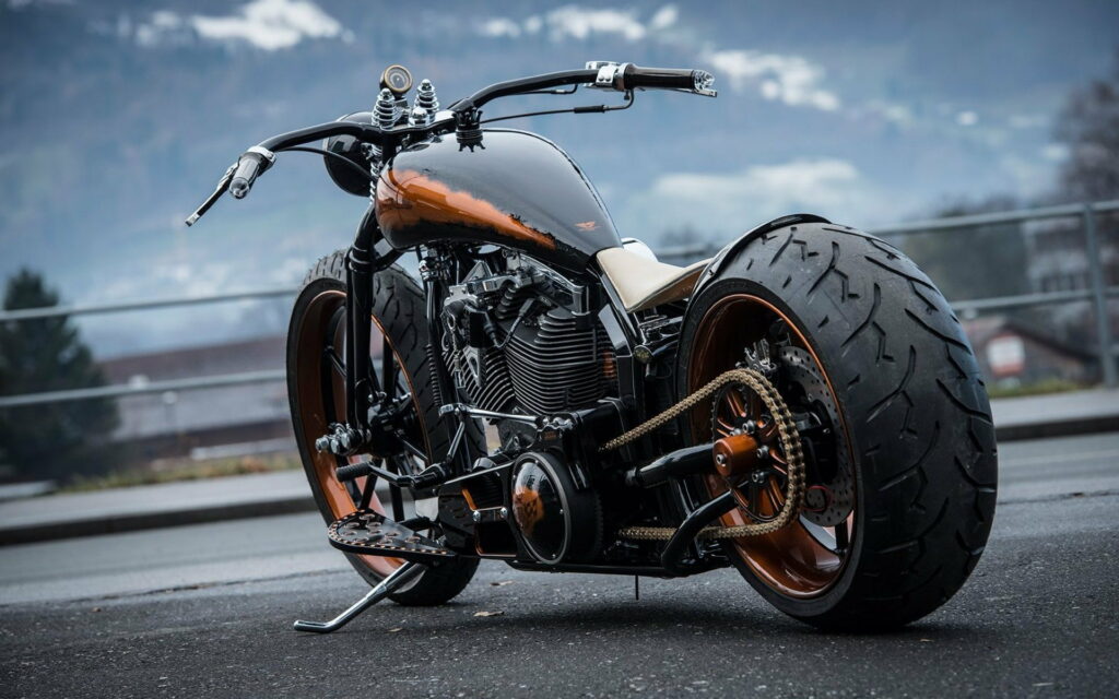 Striking Black Beauty: Captivating HD Wallpaper of a Unique Luxury Chopper with Cool Design