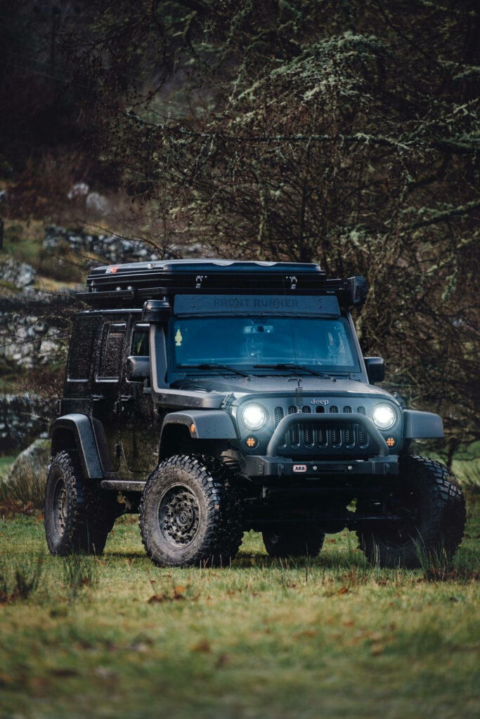 Stealthy Black Jeep Wrangler Rocking a Custom Top Rack Wallpaper