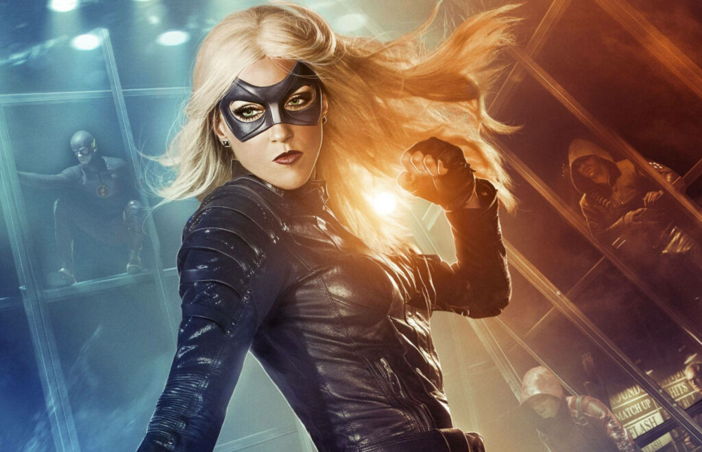 Black Canary in powerful pose with clenched fists against dynamic cityscape action wallpaper