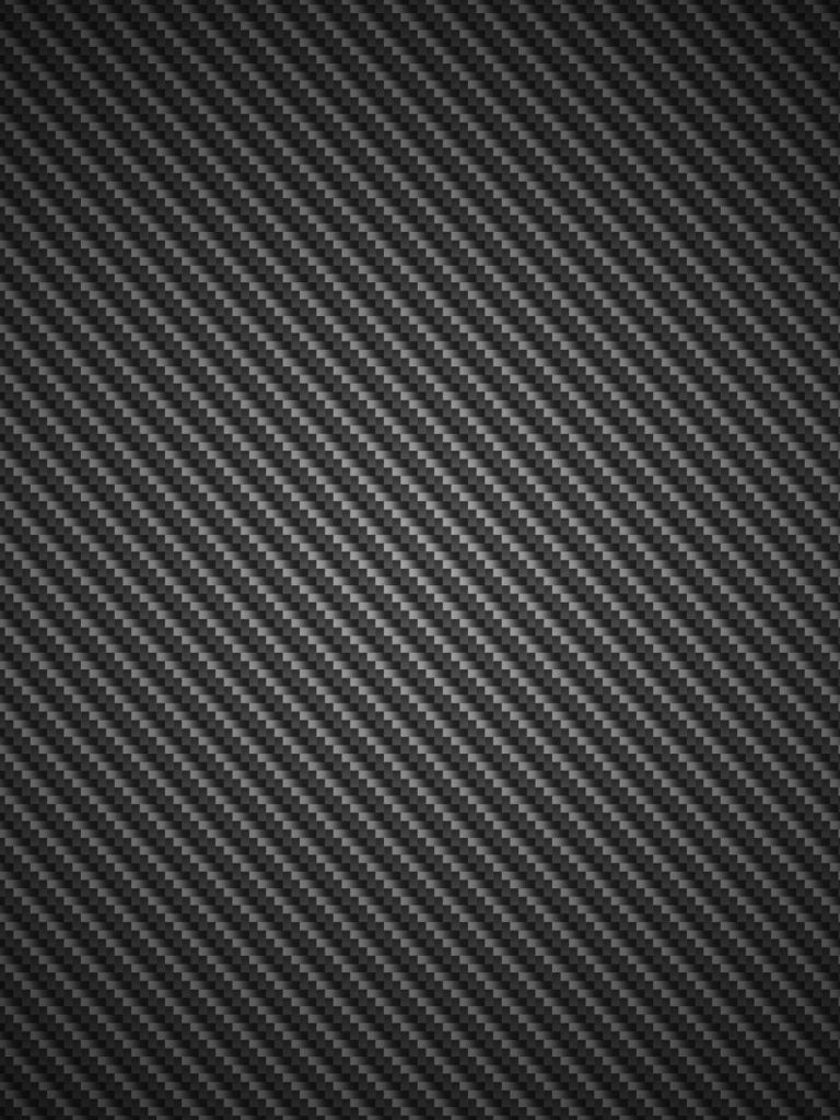 Black carbon fiber texture wallpaper with diagonal weave and subtle gradient lighting background