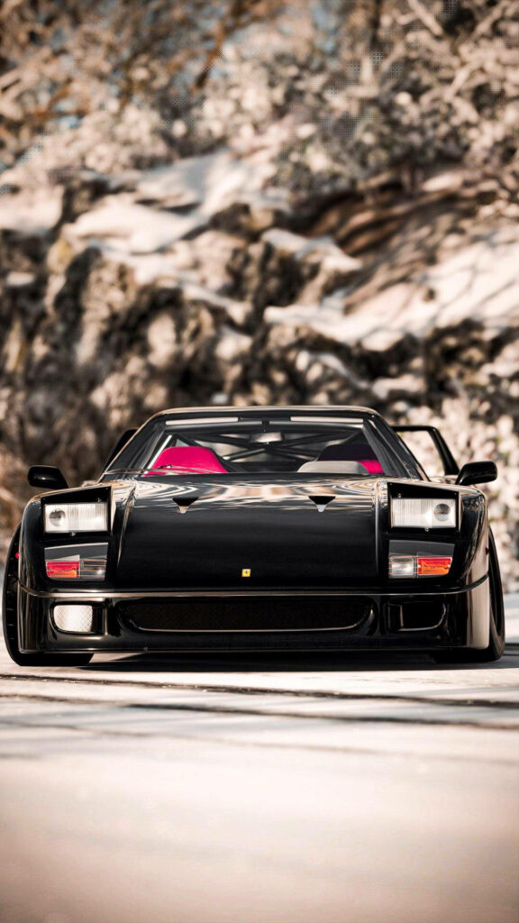 Black Ferrari F40 parked outdoors showcasing iconic design and powerful presence wallpaper