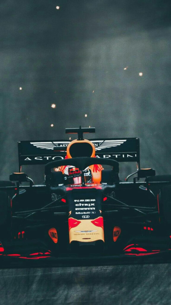 Black Formula 1 car racing fast on track dynamic sports wallpaper background for speed fans