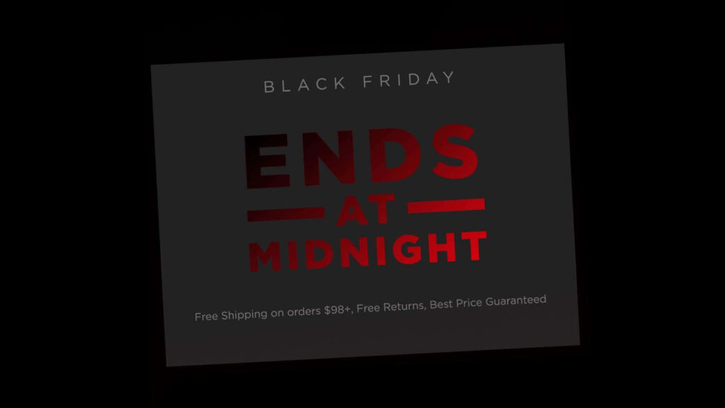 Bold red Black Friday ends at midnight text with free shipping and returns on orders over 98 wallpaper