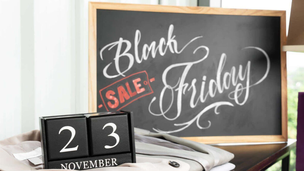 Desktop calendar showing November 23 Black Friday sale chalkboard sign holiday shopping countdown Wallpaper