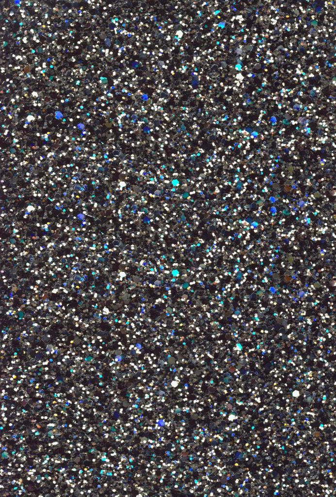 Black glitter wallpaper with dense silver and blue sparkling particles on dark backdrop