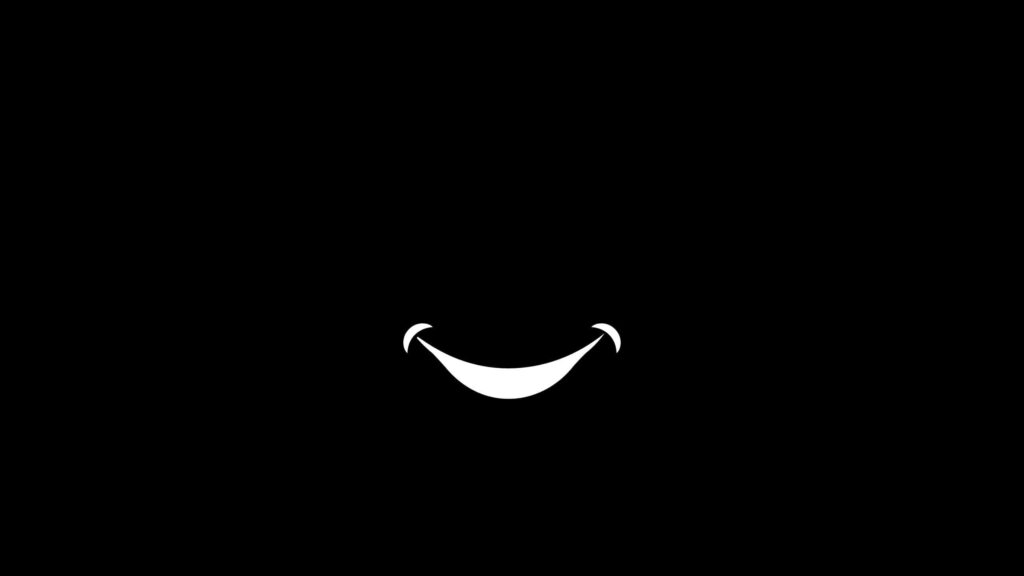 Ink on Shadows: The Moody Monochrome Grin Wallpaper