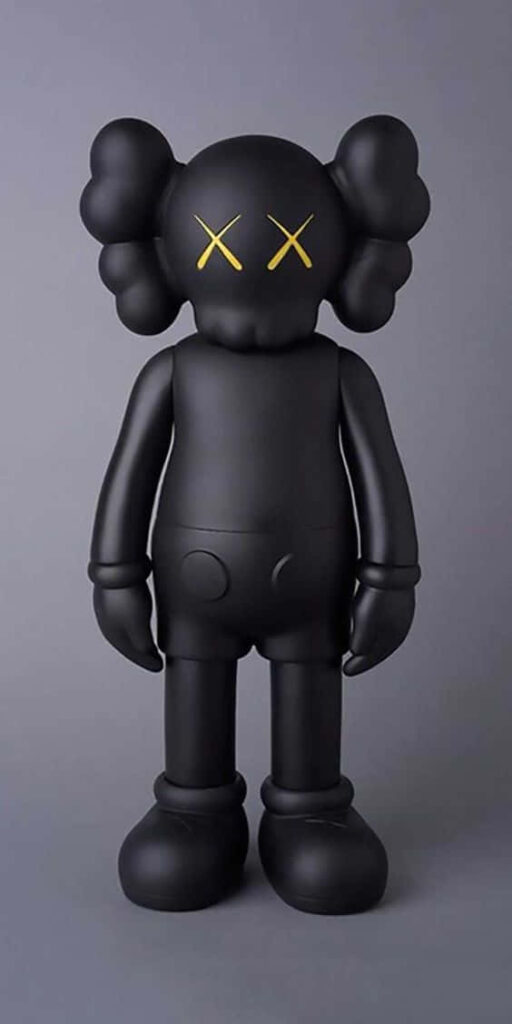 Full body black Kaws figure with crossed-out yellow eyes on minimalist gray background wallpaper