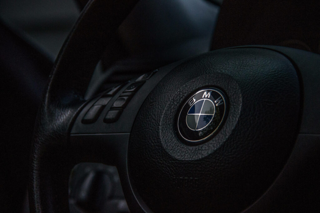 Black Leather Elegance: A BMW Steering Wheel Laptop Wallpaper