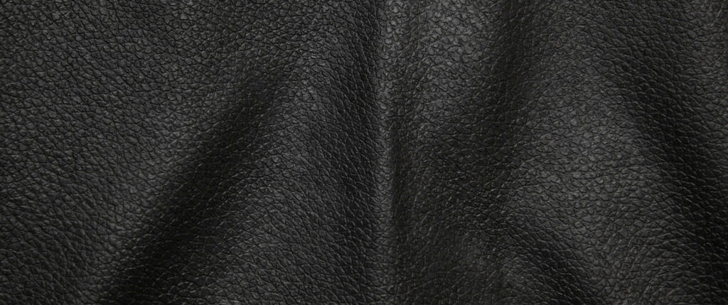 Elegant Black Leather Texture Close-Up: Natural Bulges & Fine Grain Wallpaper