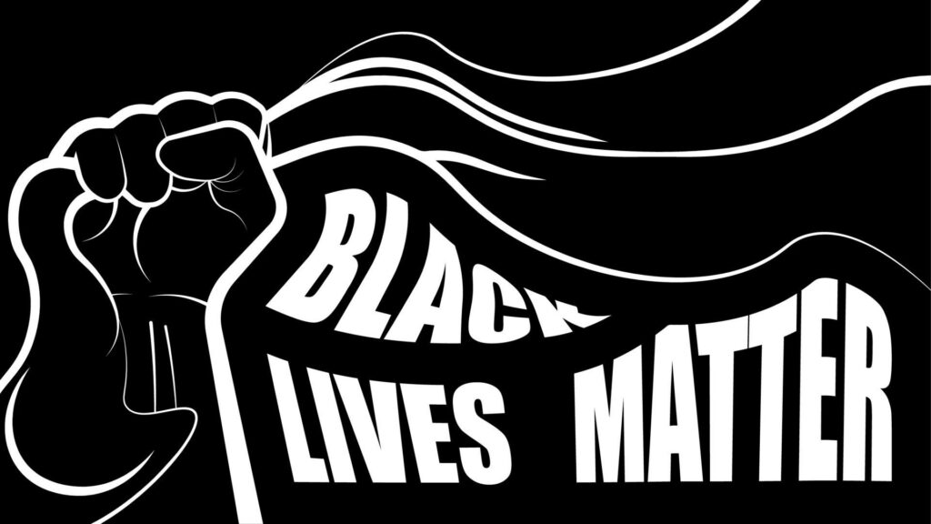 Black and white raised fist holding Black Lives Matter banner symbolizing strength and unity Wallpaper