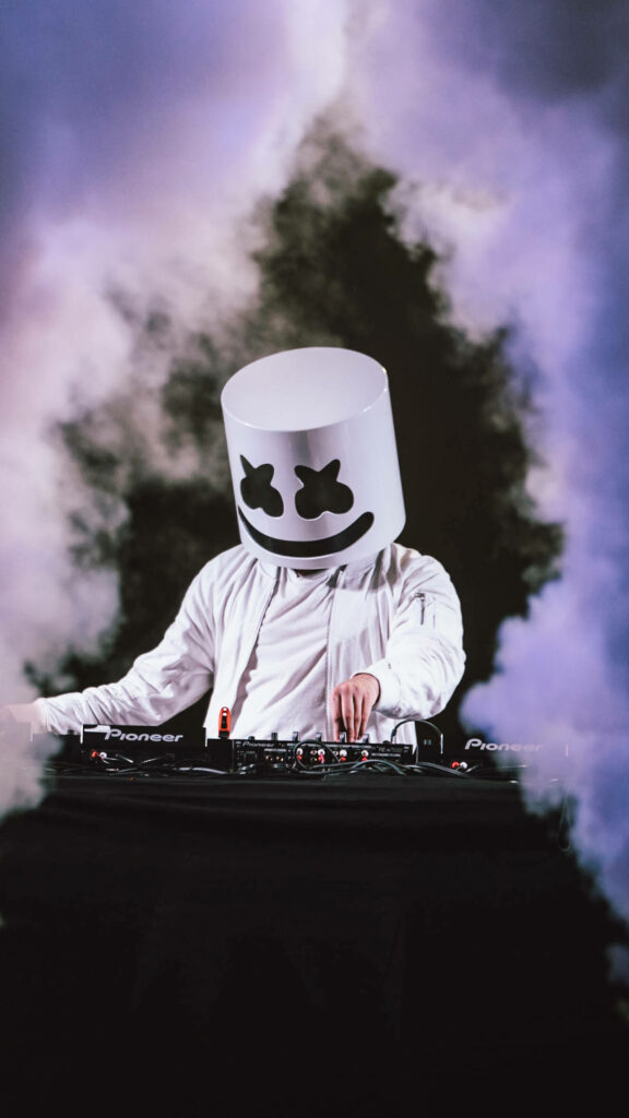 Enigmatic Visuals: Captivating Black Marshmello - Mesmerizing DJ Performance Amidst a Smoky Concert Wallpaper