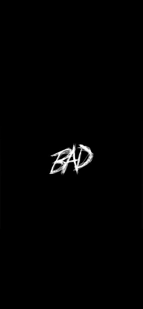 Bold Minimalist Wallpaper: Black Background with Edgy 'BAD' Design