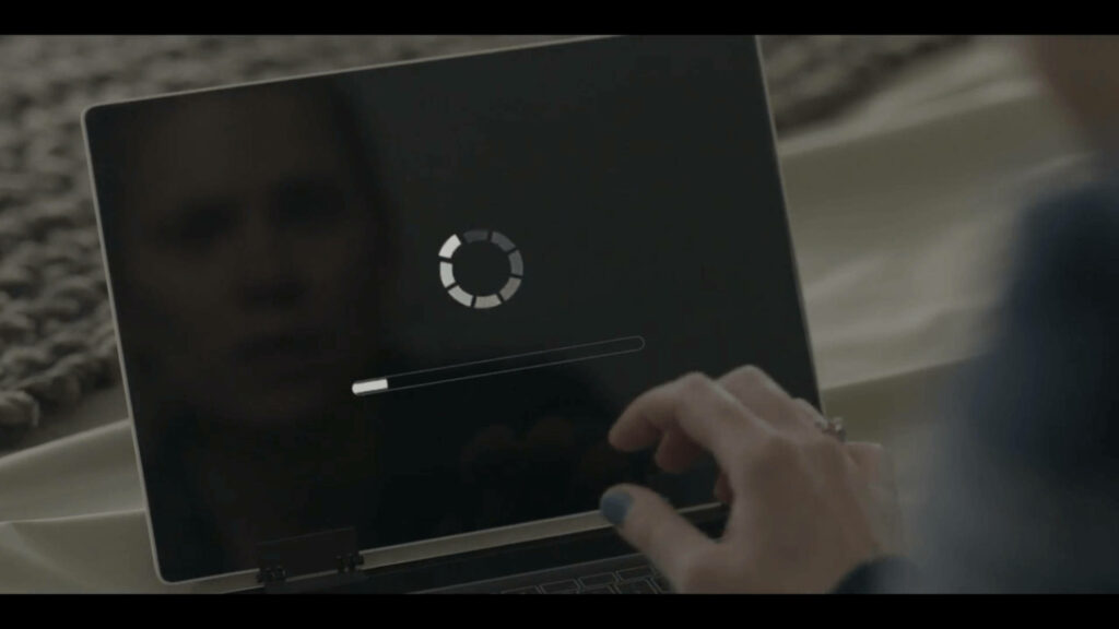 Thought-Provoking Black Mirror Wallpaper with Loading Laptop Screen