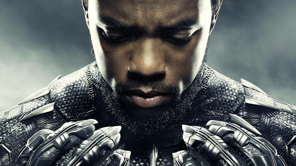 Close-up of Chadwick Boseman as Black Panther showing detailed suit and intense expression wallpaper