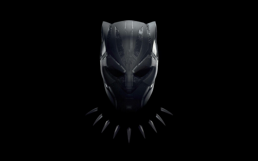 Black Panther mask wallpaper with intricate Wakandan patterns on dark background superhero design