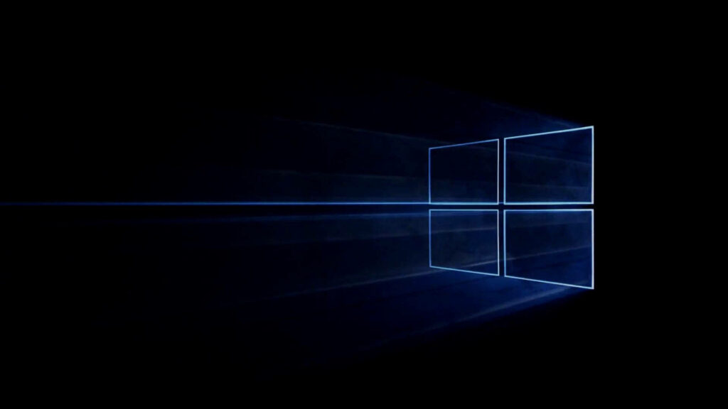 Neon Illumination: Dark Backdrop Highlights Windows 10 HD Logo Wallpaper