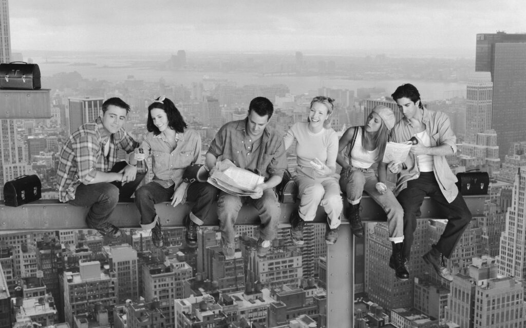 Black-and-White Friends Wallpaper: Characters atop City Skyline