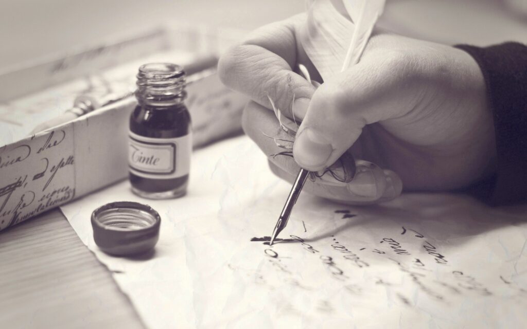 Timeless Black and White Wallpaper: Quill and Ink on Aged Paper