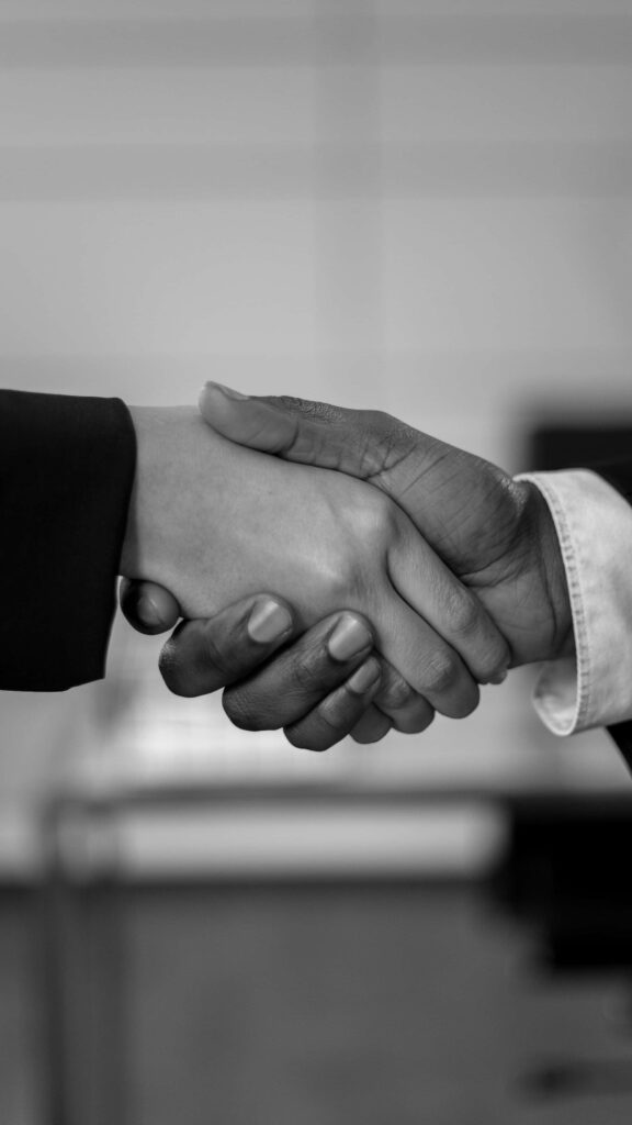 Timeless Black and White Wallpaper: Handshake Symbolizing Partnership
