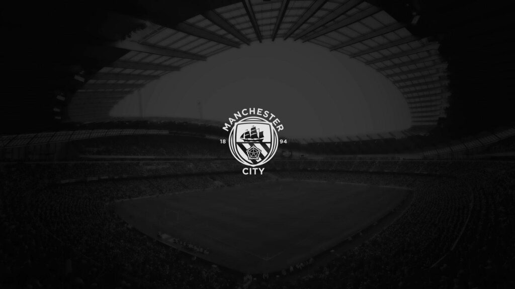 Manchester City's Small but Mighty Logo: A Classy 4k Black Wallpaper with White Emblem on Stadium Background in 1080p Full HD 1920x1080 Resolution