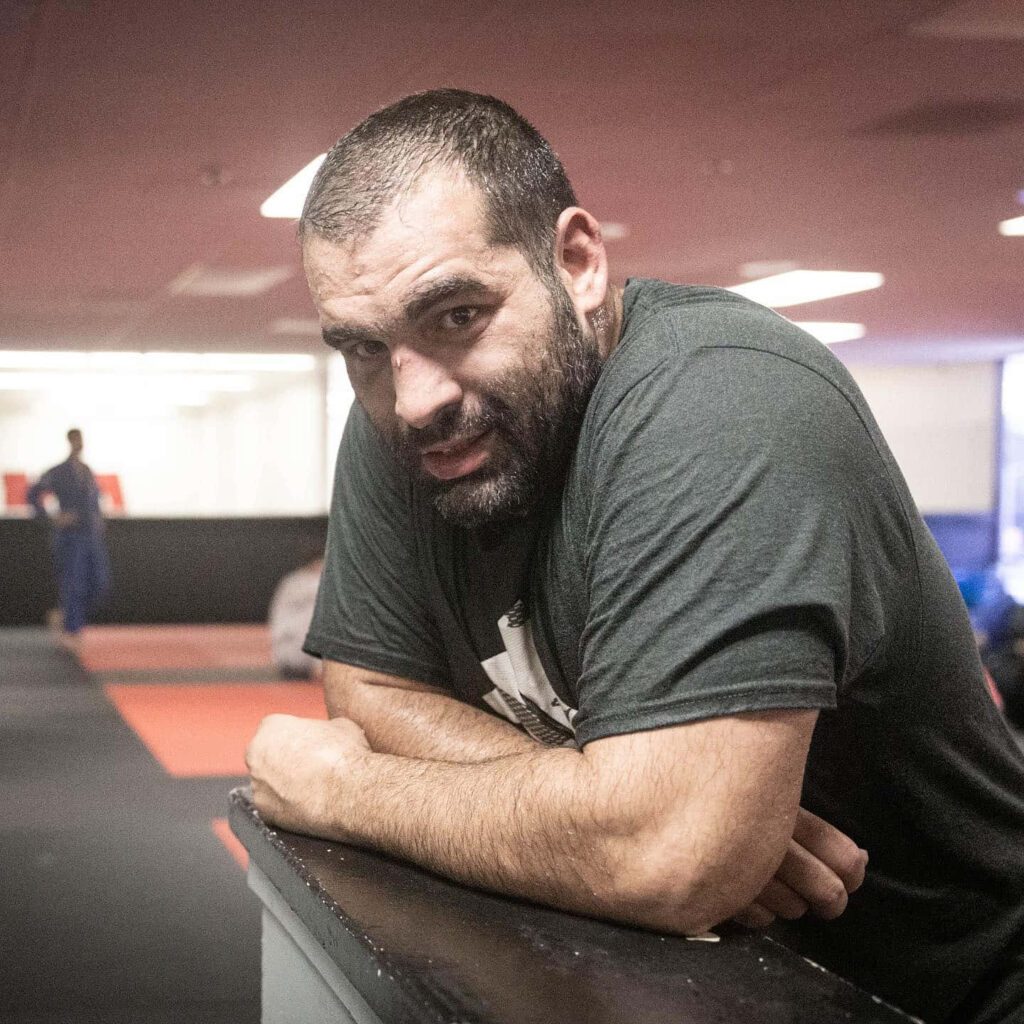 Blagoy Ivanov focused gym portrait leaning on bench intense determination wallpaper background