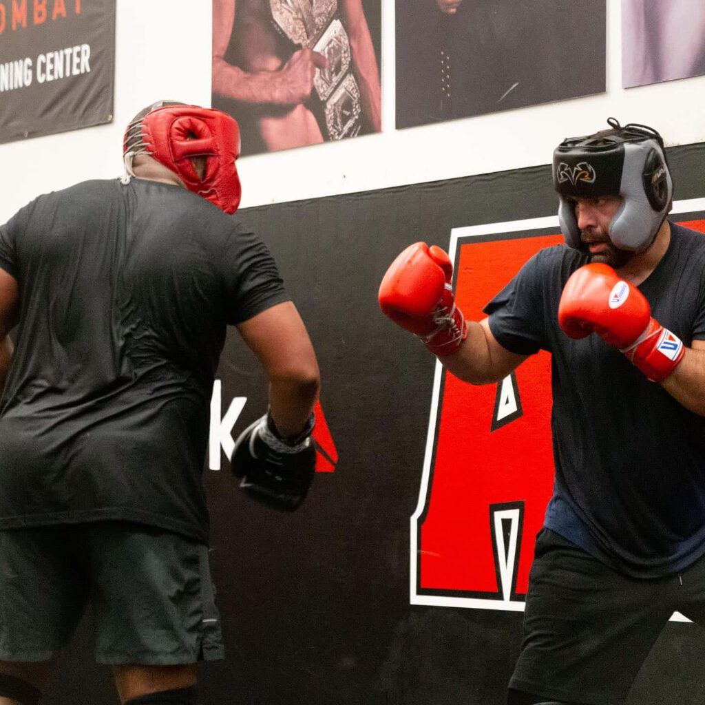 Blagoy Ivanov intense fight training with boxing gloves headgear in gym wallpaper background