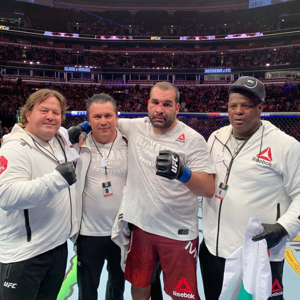 Blagoy Ivanov celebrates UFC victory with training team and coaches inside arena wallpaper background
