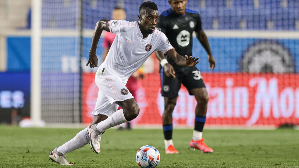 Inter Miami Blaise Matuidi kicking ball mid-action intense soccer match athletic player Wallpaper