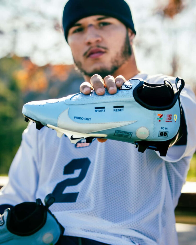 Blake Corum showing custom designed cleats with unique details and personalized style wallpaper