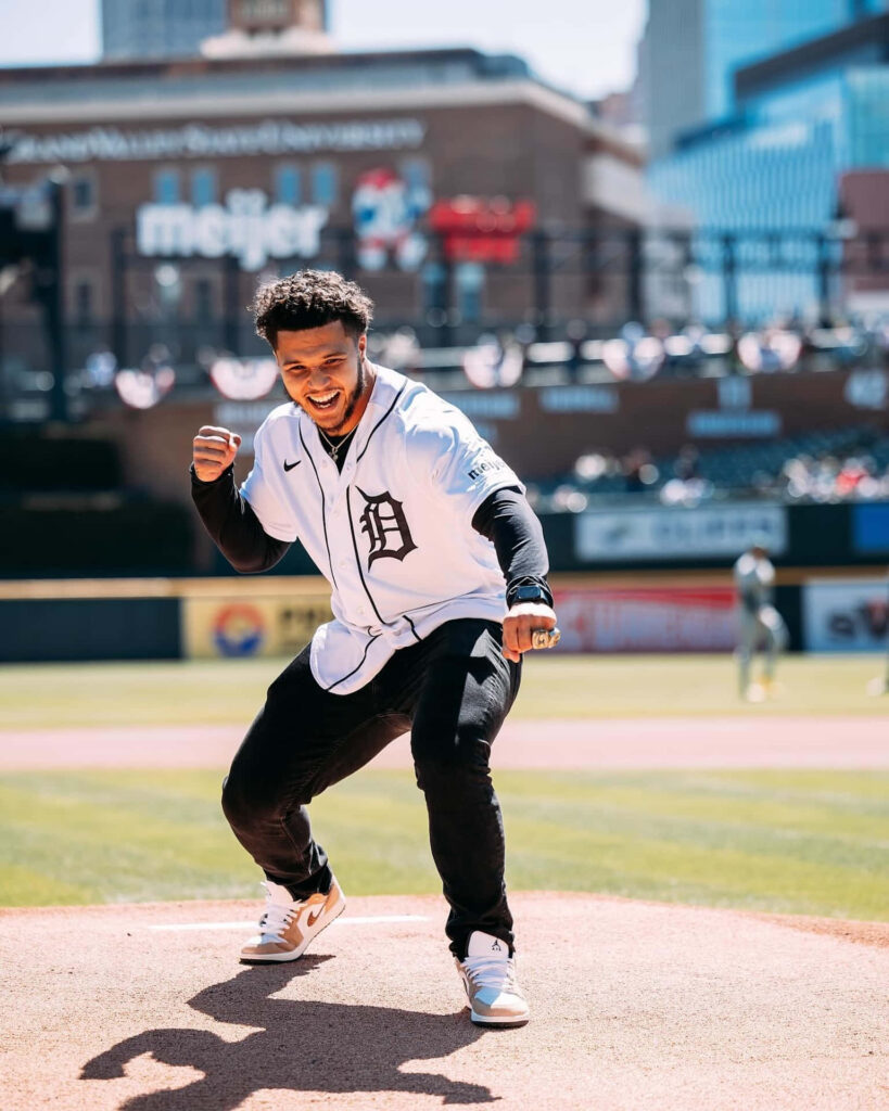 Blake Corum in dynamic athletic pose on baseball field showing excitement and confidence wallpaper