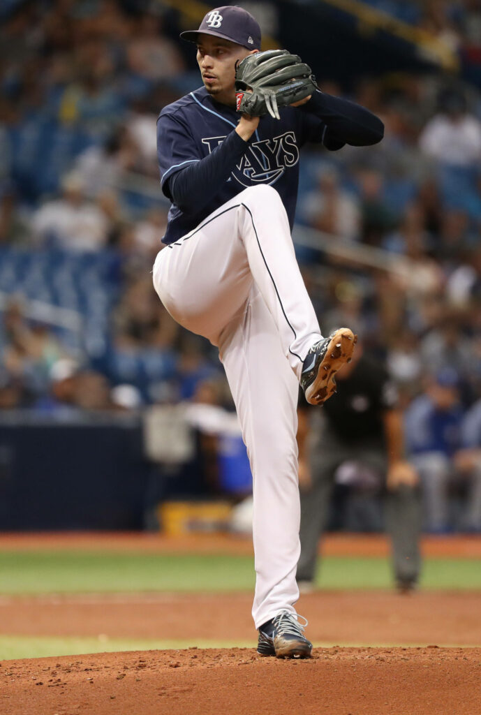Blake Snell pitching for Tampa Bay Rays focused on mound during intense game action wallpaper
