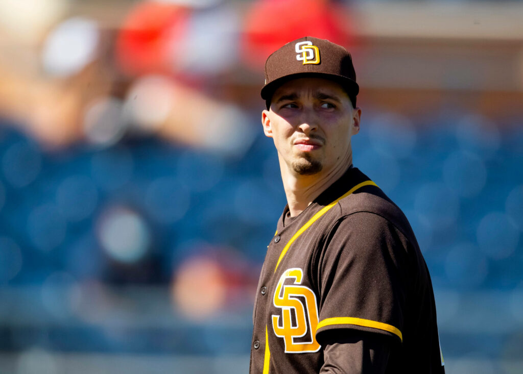 Blake Snell in San Diego Padres uniform with intense focused expression and dramatic shadow Wallpaper