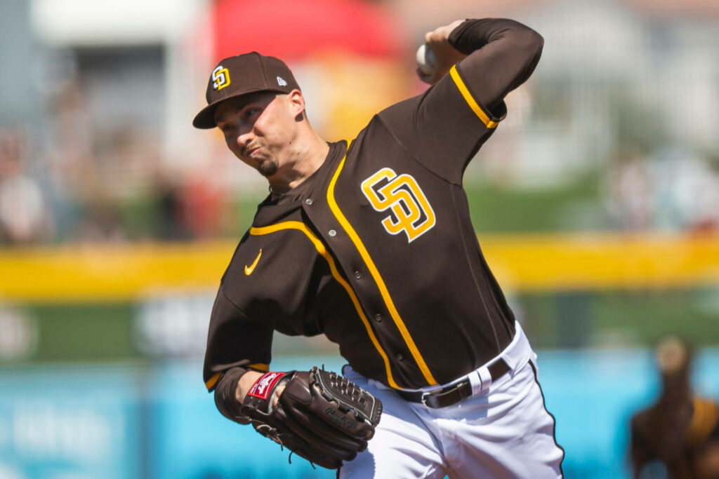 Blake Snell pitching powerfully in San Diego Padres uniform showing intense focus on mound Wallpaper