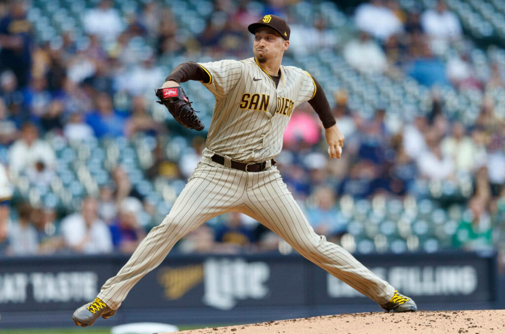 Blake Snell pitching powerfully for San Diego Padres mid-throw on baseball mound wallpaper