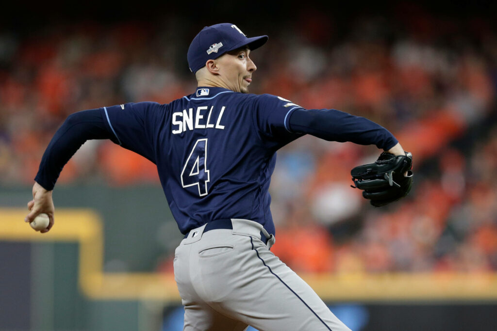 Blake Snell pitching from behind in Tampa Bay Rays uniform during intense baseball game action Wallpaper