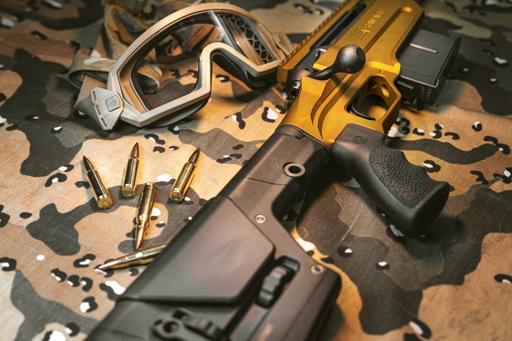 Blaser R8 gold black rifle with brass cartridges Smith Optics goggles camo tactical wallpaper
